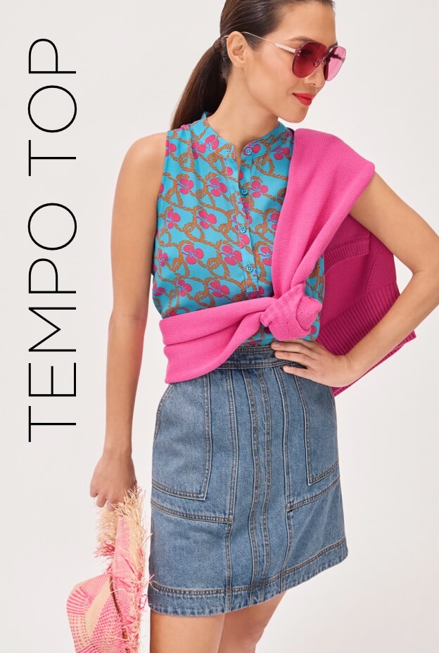 Model wearing Tempo Top in Happy Flower, Knockout Pullover in Punch, and the Speedway Skirt in Retro Wash.