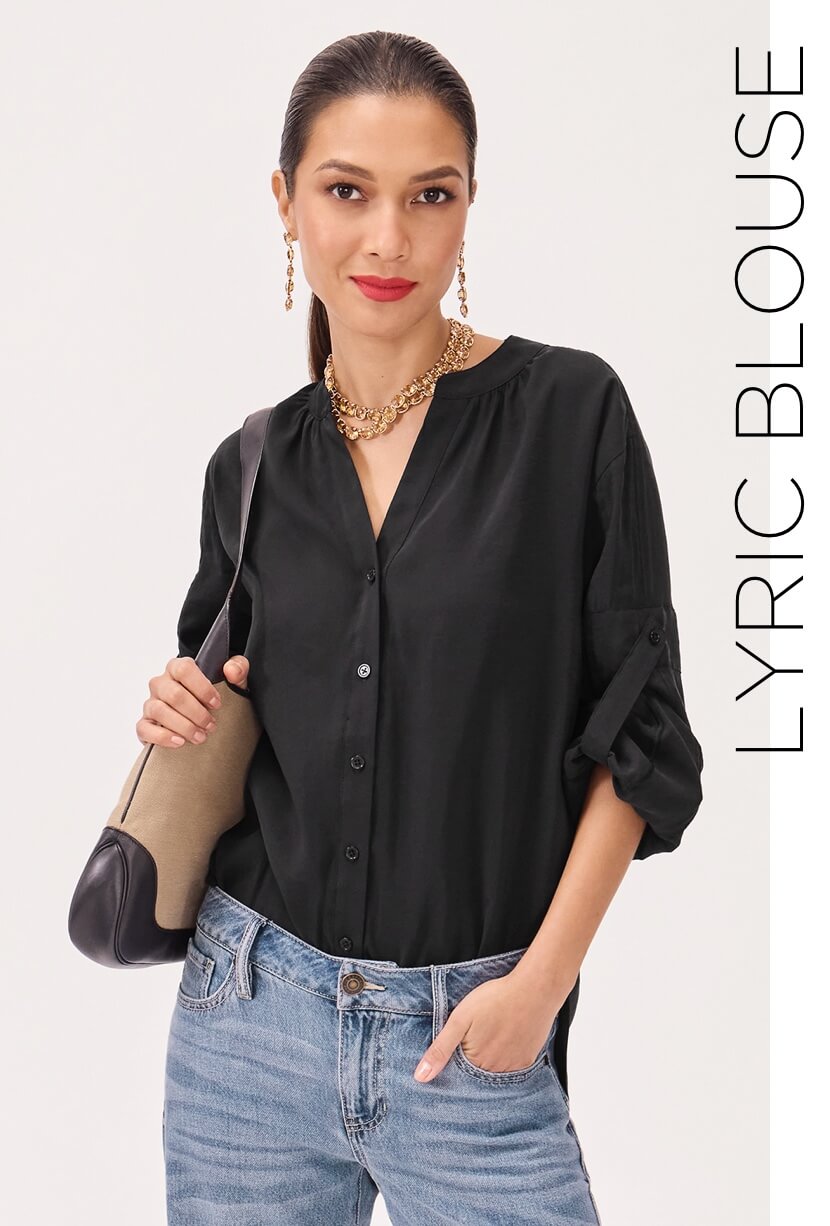 Model wearing the Lyric Blouse in Black, Twinkle Earrings and Necklace in Gold, and the Ashbury Jean in Faded Wash.