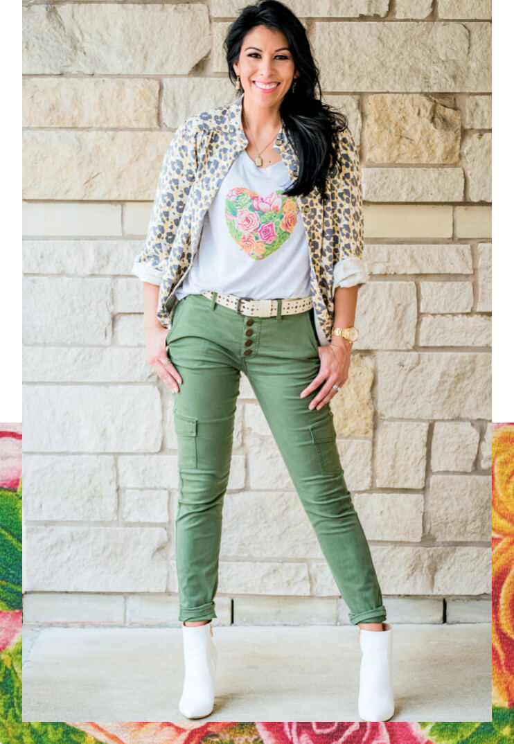 Female model wearing the cabi Botanical Tee in Heather Grey, Providence Shirt Jacket in Safari Print, and the Button Fly Cargo in Olive