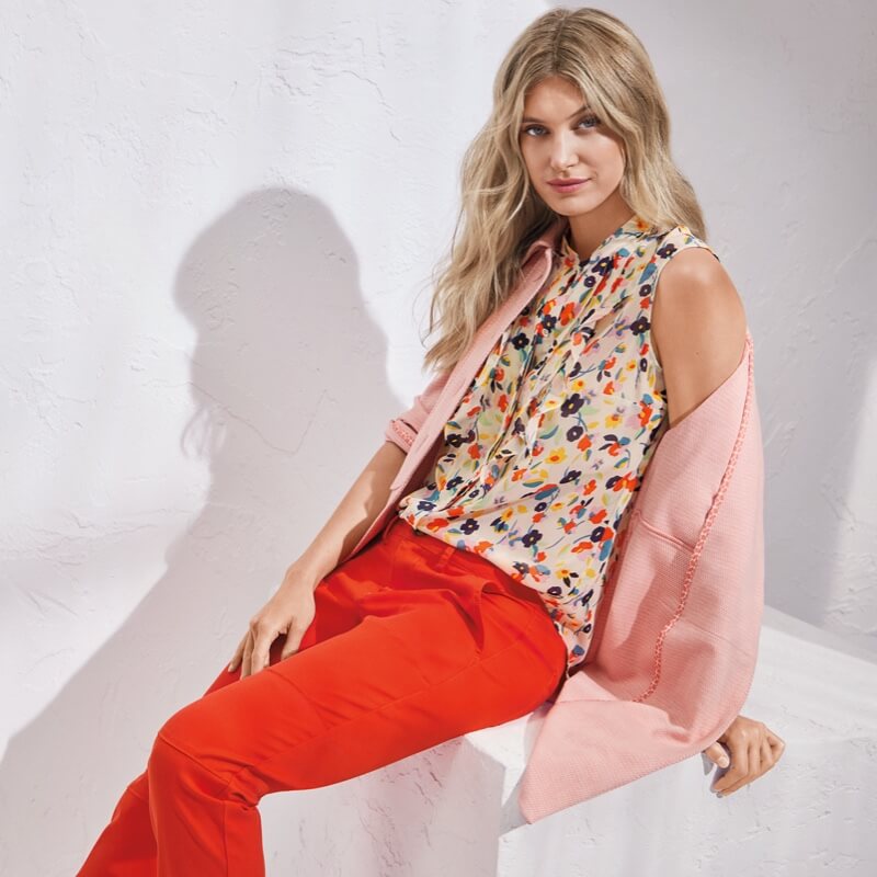 Model Wearing Take 5 Topper in Flamingo, Tux Ruffle Top in Multi Floral, Utility Trouser in Coral