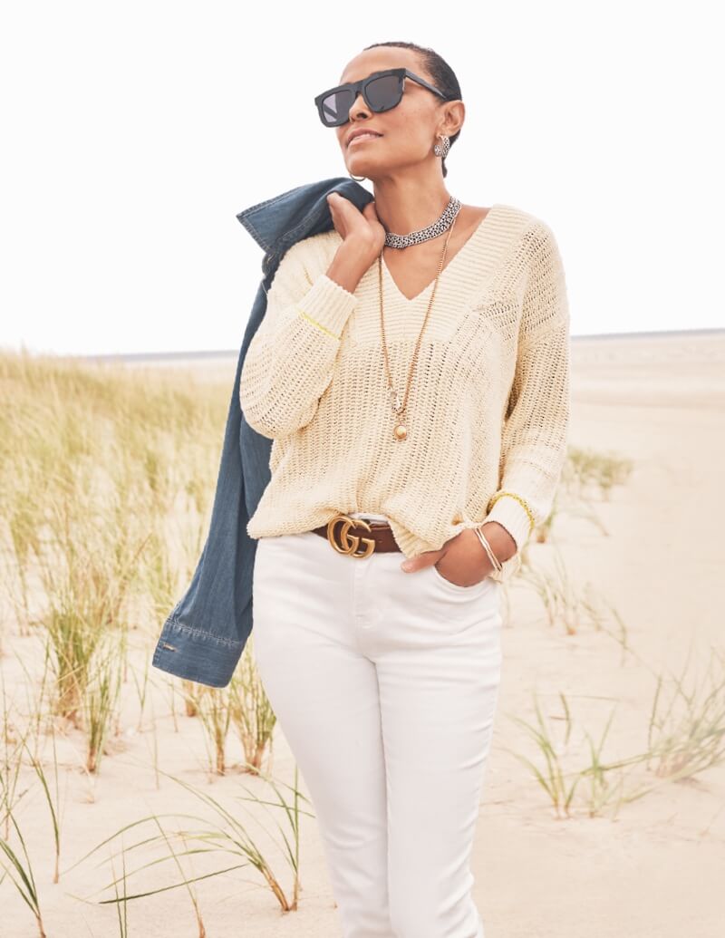 Model wearing  Keep Jacket in Original Wash, Croquet Pullover in Alabaster, 5th Ave Jean in White, Lagoon Necklace in Gold, Collar Necklace in Silver, Collar Hoop Earrings in Silver