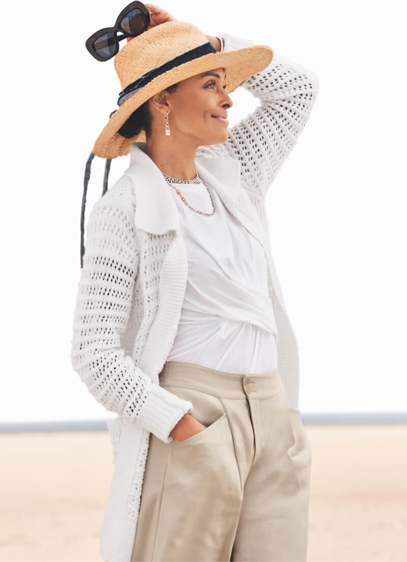 Model wearing Open Stitch Cardigan in White, Swag Tee in White, Traipse Trouser in Biscotti, Collar Necklace, Lock-It Earrings in Silver