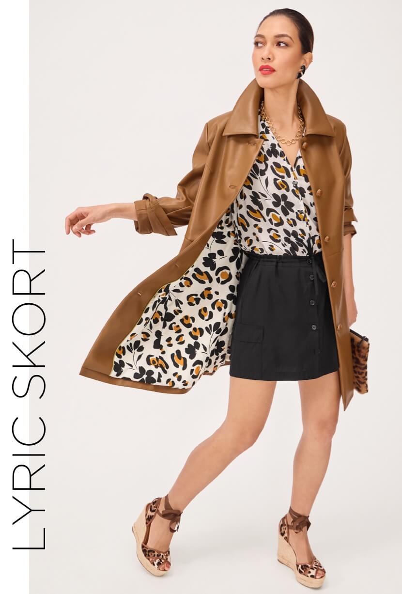 Model wearing Lyric Skort in Black, Joplin Jacket in Caramel, and the Cavort Top in Flower Leopard Print.